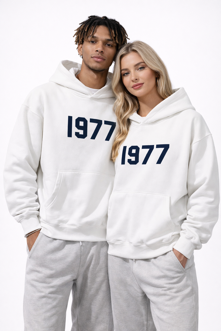 Modern unisex streetwear hoodie with classic 1977 print and comfortable raglan construction.