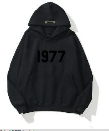 Comfortable unisex streetwear hoodie with unique raglan sleeves & vintage 1977 design.