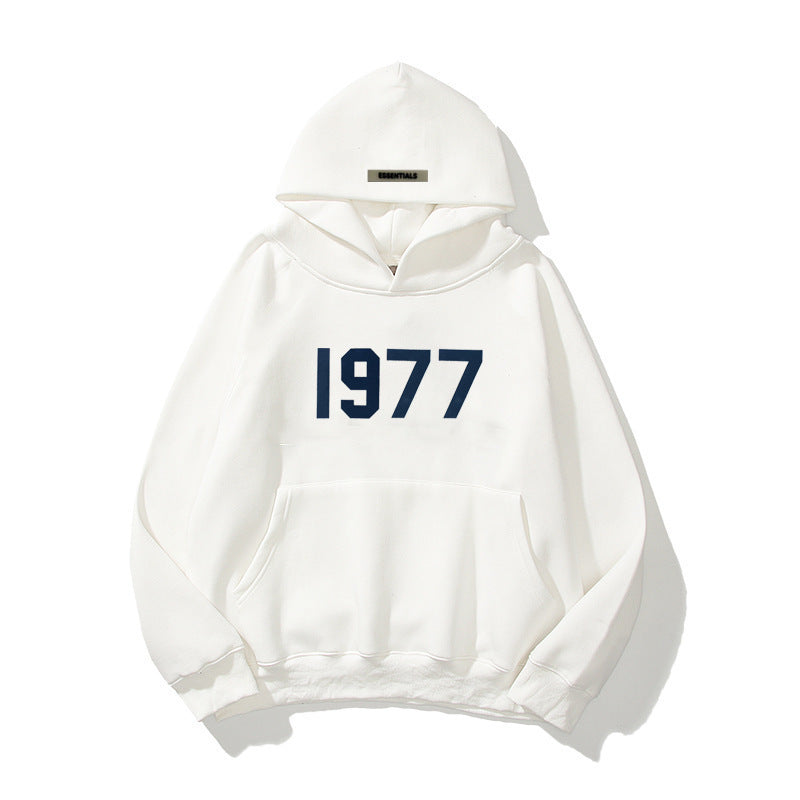 Unisex raglan sleeve hoodie featuring a retro 1977 print & comfortable fit.