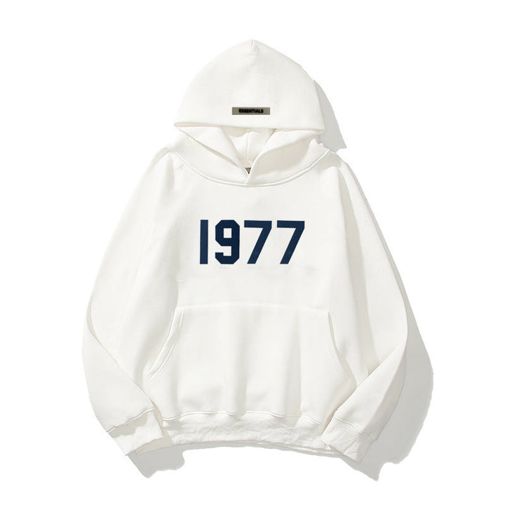 Unisex raglan sleeve hoodie featuring a retro 1977 print & comfortable fit.