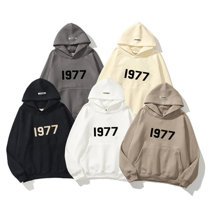 Streetwear pullover hoodie, unisex, with vintage 1977 print and kangaroo pocket.