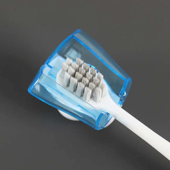 Close-up of clear suction cup toothbrush cover, showing strong grip for bathroom wall, 125 characters