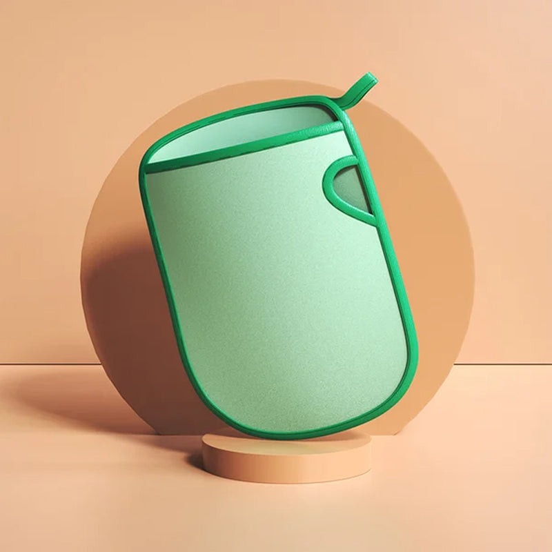 Exfoliating bath mitt in hand, demonstrating its size and flexible PVA material