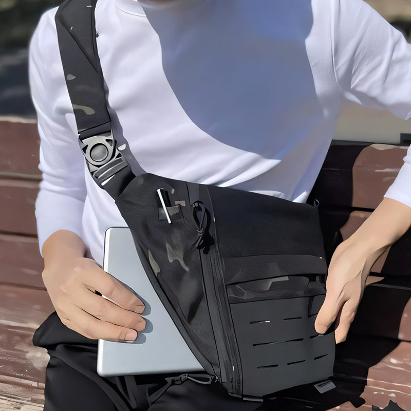 Front view of black tactical sling bag, cross-body design with multiple pockets for men & women
