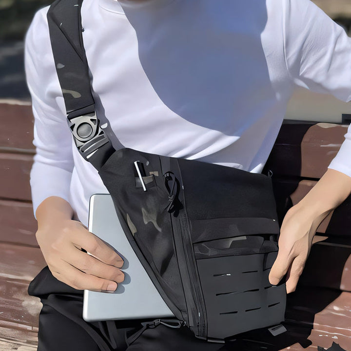 Front view of black tactical sling bag, cross-body design with multiple pockets for men & women