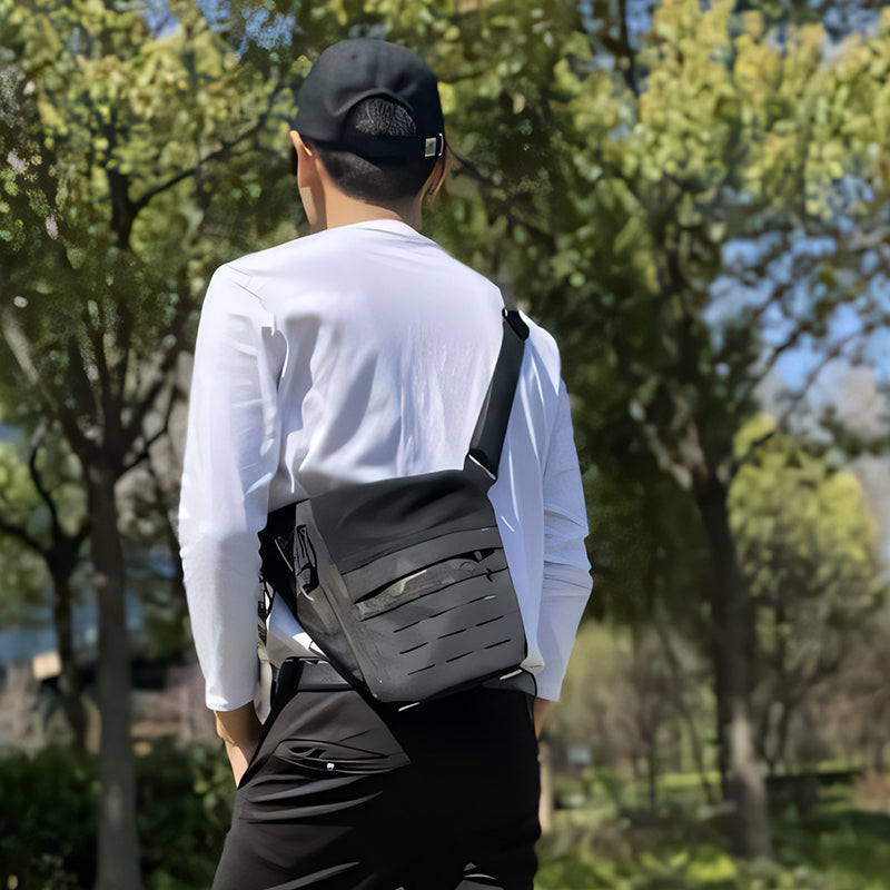 Side profile of a grey nylon tactical crossbody bag, perfect outdoor gear & travel companion