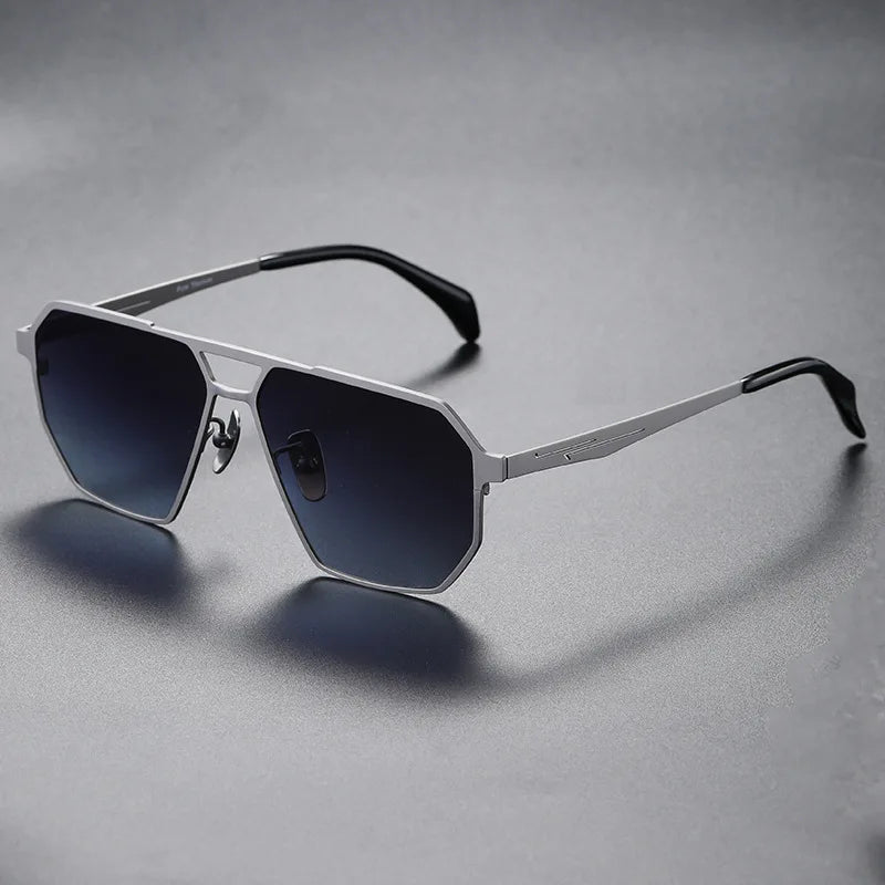 Pair of unisex titanium sunglasses, polarized, presented against a sunny outdoor background, chic eyewear