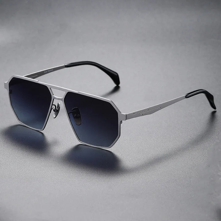 Pair of unisex titanium sunglasses, polarized, presented against a sunny outdoor background, chic eyewear