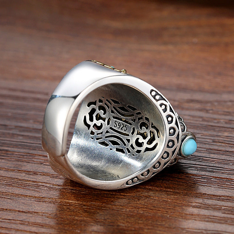 Side profile of the adjustable Dzi bead spinner ring, natural turquoise and spiritual mantra