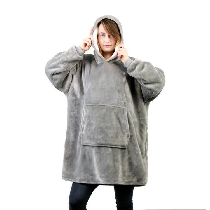 Flat lay of the wearable blanket sweatshirt, emphasizing its luxurious soft and plush feel