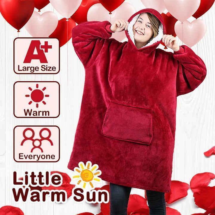 Back view of a person wearing the unisex wearable blanket, highlighting its roomy fit and hood