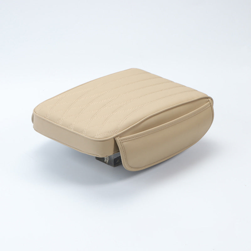 Packaged universal leather car armrest cushion, ready for installation and immediate car comfort.