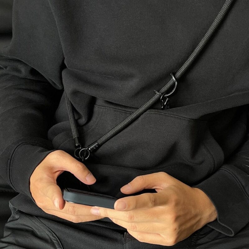 Detail of the secure attachment point of the Universal Phone Crossbody Lanyard, ensuring phone safety.