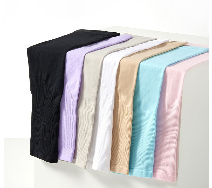 Athletic unisex arm sleeves with UPF 50 sun protection. Essential outdoor gear for sports & driving.