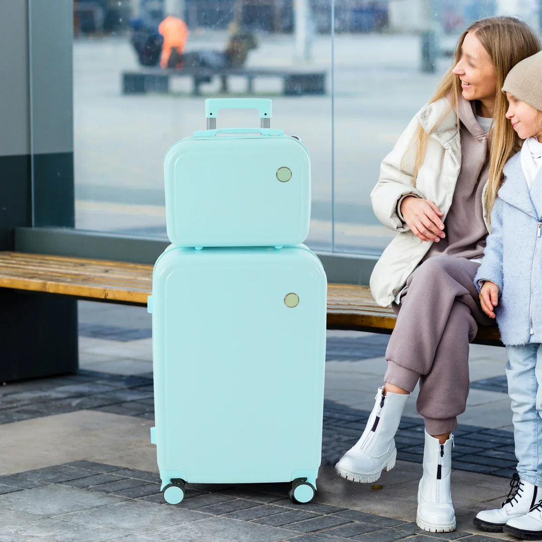 Hard shell Vienna Duo travel luggage set. Green suitcase and pink cosmetic case for secure, durable travel.
