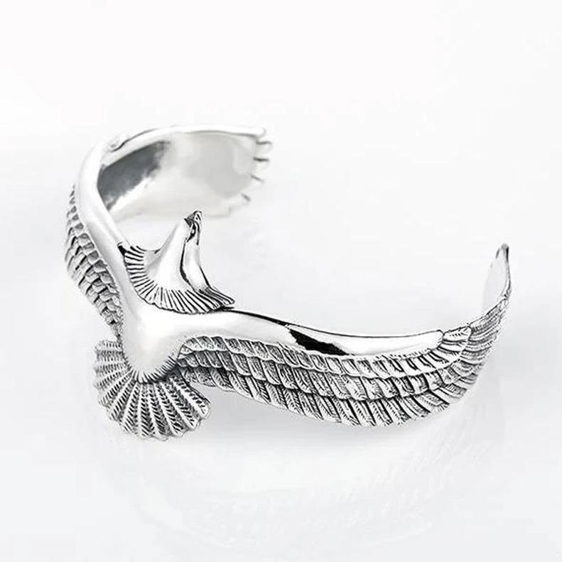 Artistic shot of an adjustable copper bracelet with a prominent eagle motif, a unique fashion accessory.
