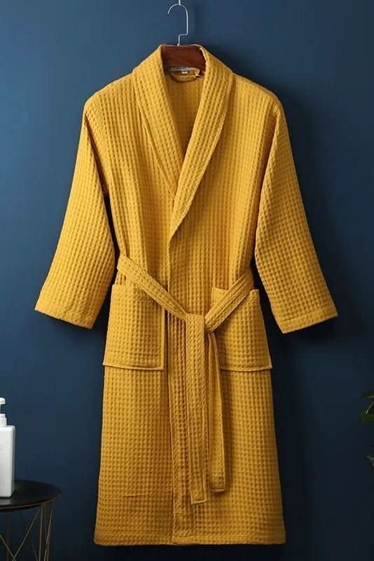 White unisex waffle bathrobe, highly absorbent and breathable for cozy home loungewear & spa comfort.