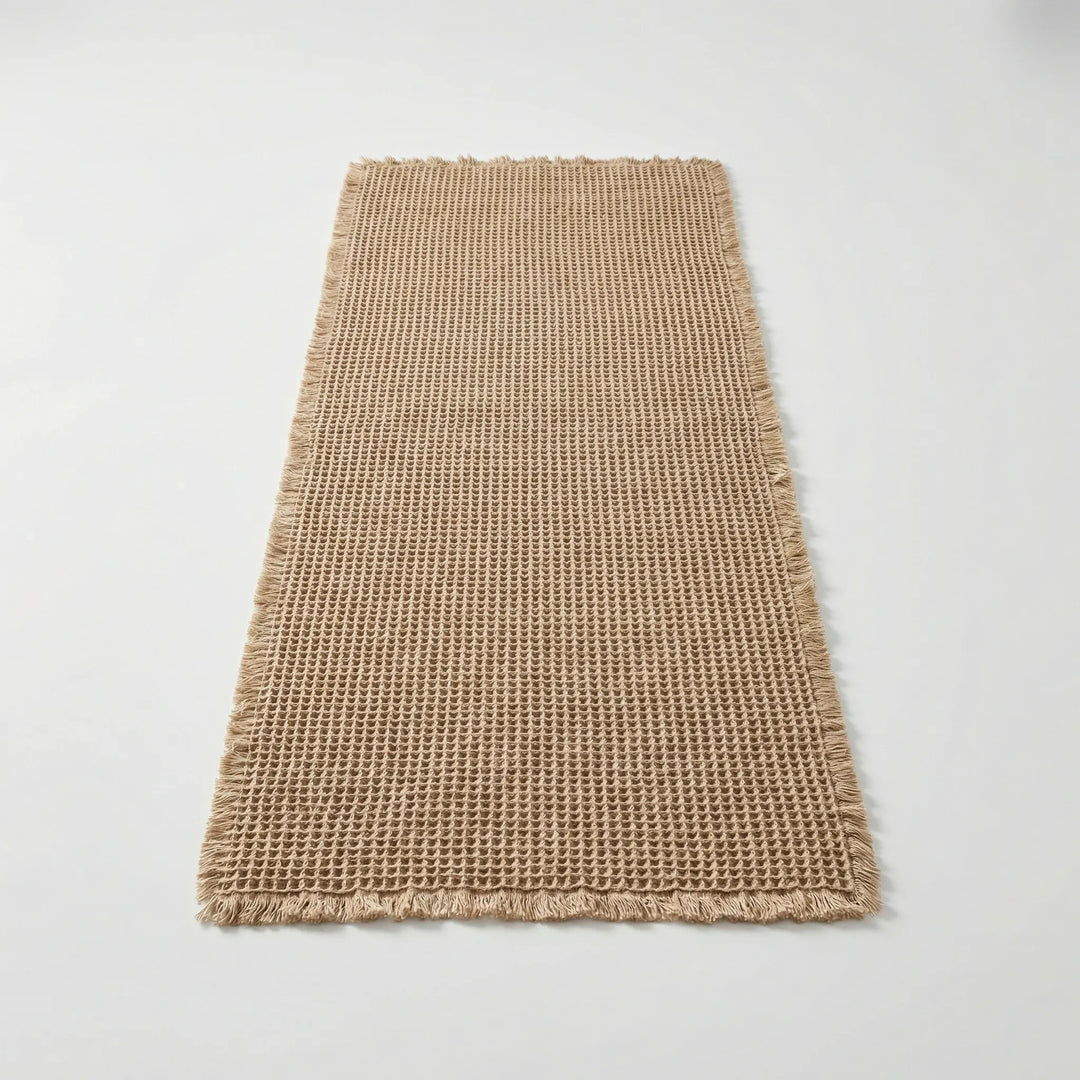 Soft Flowique waffle textured non-slip bath runner mat with waves, perfect for modern bathroom decor.