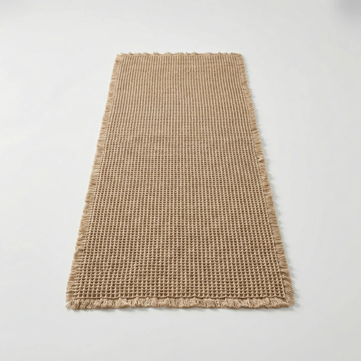 Soft Flowique waffle textured non-slip bath runner mat with waves, perfect for modern bathroom decor.