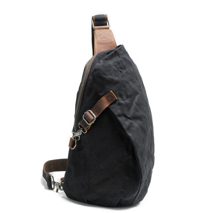 Person wearing a unisex water-resistant canvas crossbody bag, showcasing its secure anti-theft pocket.