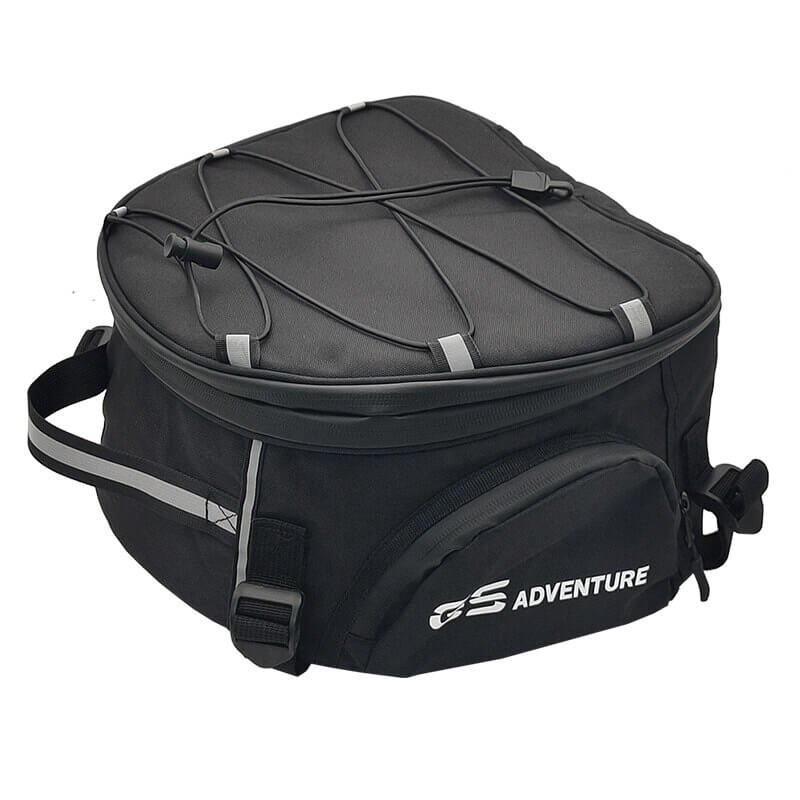 Rider preparing for a trip with a spacious, water-resistant motorcycle travel bag for gear and luggage.