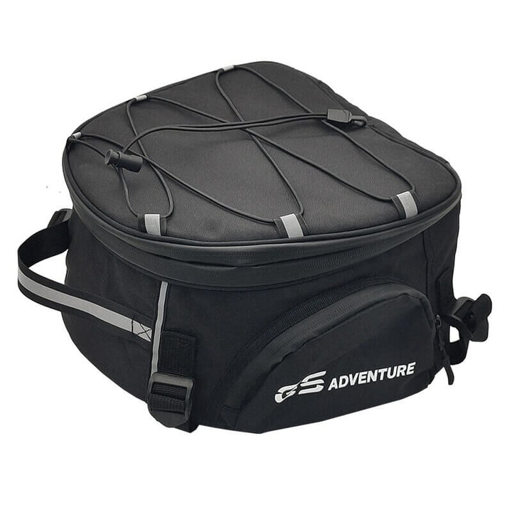 Rider preparing for a trip with a spacious, water-resistant motorcycle travel bag for gear and luggage.
