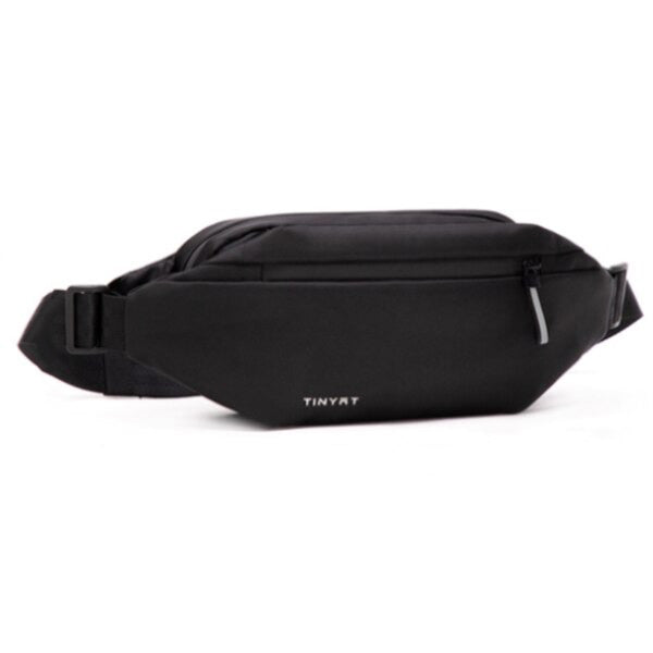 Interior view of a fanny pack revealing spacious compartments for organized everyday carry. Unisex travel bag.