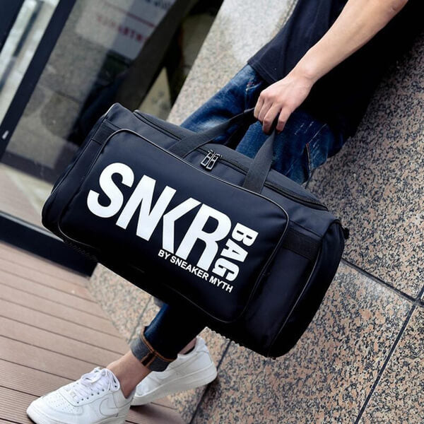 Unisex water-resistant sneaker & gear travel bag with multiple compartments for shoes & sports equipment.
