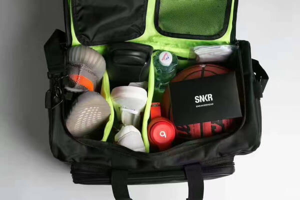 Unisex water-resistant travel bag, perfect for carrying sneakers, workout gear & personal items. Duffel style.