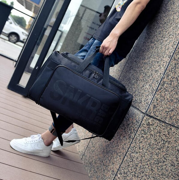 Compact unisex travel bag for shoes & essentials. Water-resistant & easy to carry on trips. Gear storage.