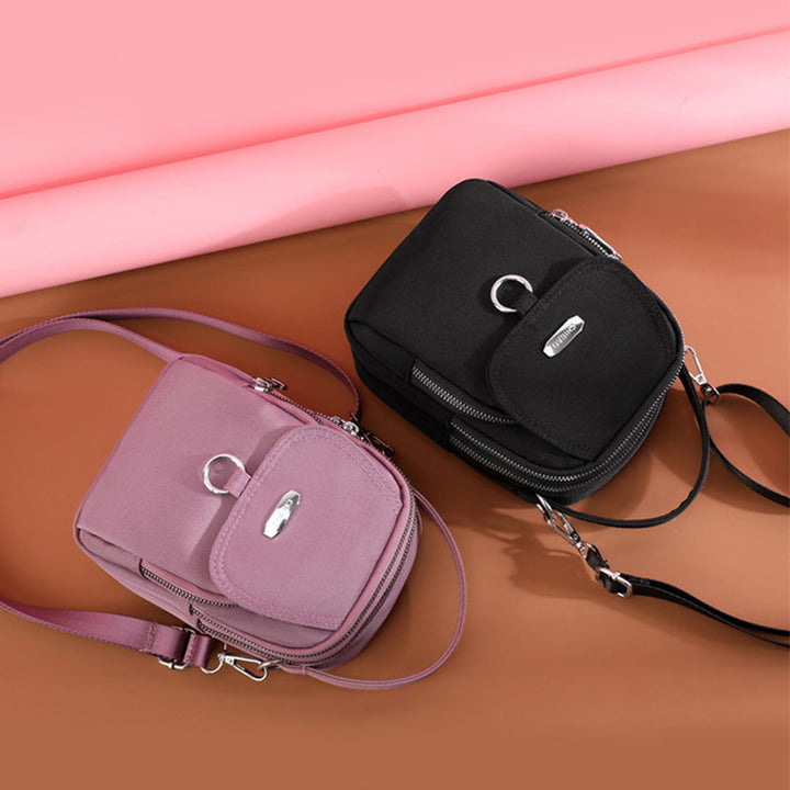 Waterproof nylon crossbody bag, unisex, multipocket design, ideal for daily commutes & travel