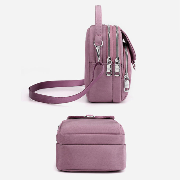 Compact waterproof crossbody bag, unisex, black nylon, perfect for keeping essentials secure