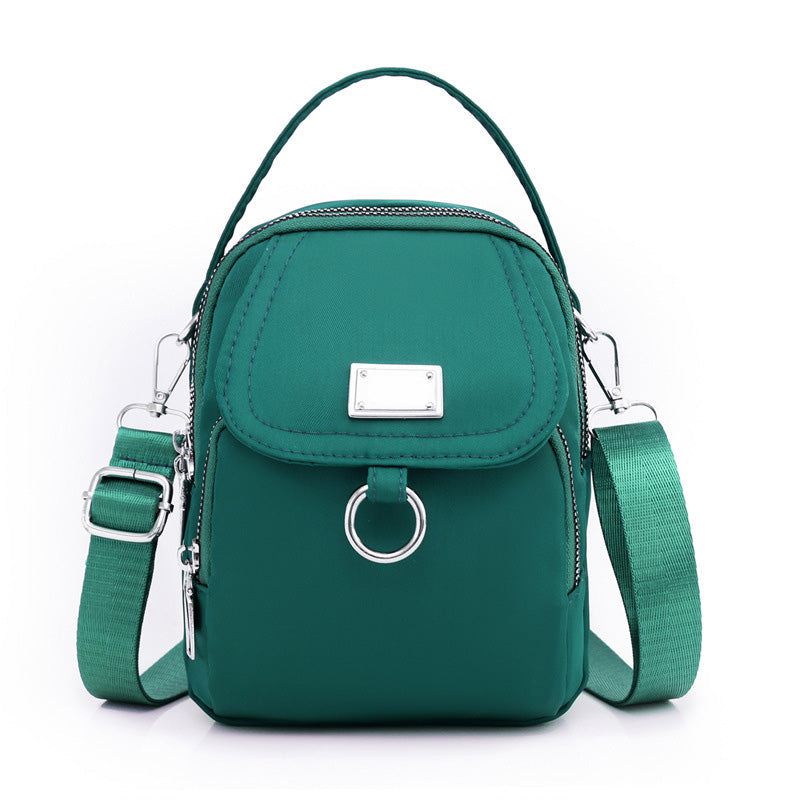 Waterproof crossbody bag for work or leisure, with front zipper pocket detail