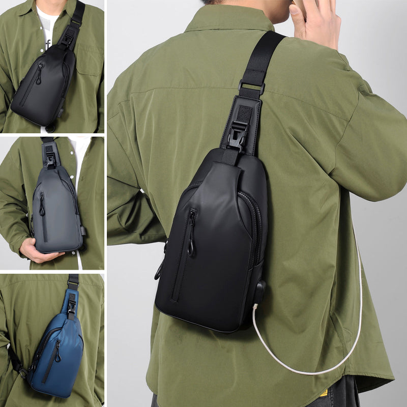 Unisex waterproof USB charging travel sling bag in black, shown from front with USB port visible.