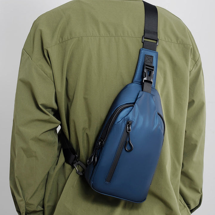 Unisex waterproof sling bag ready for a hike, illustrating its practical use outdoors.