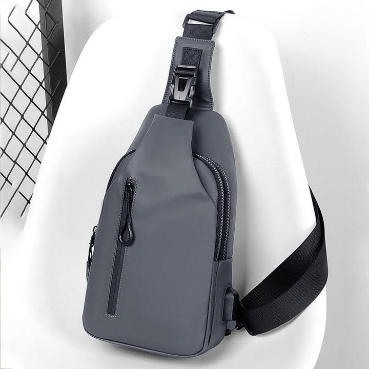 Unisex USB charging sling bag being worn casually, emphasizing its lightweight feel.