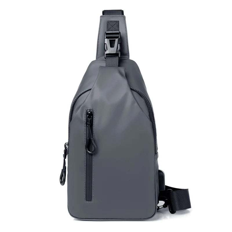 Traveler using a black unisex waterproof USB charging sling bag at an airport.