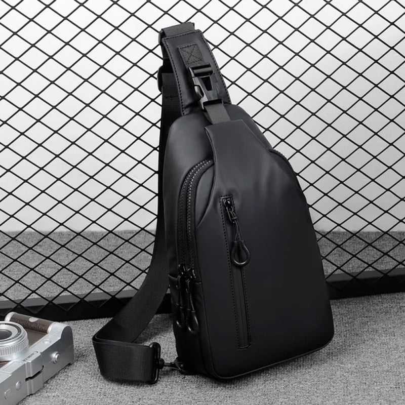 Back view of unisex travel sling bag, showing adjustable strap and breathable mesh padding.