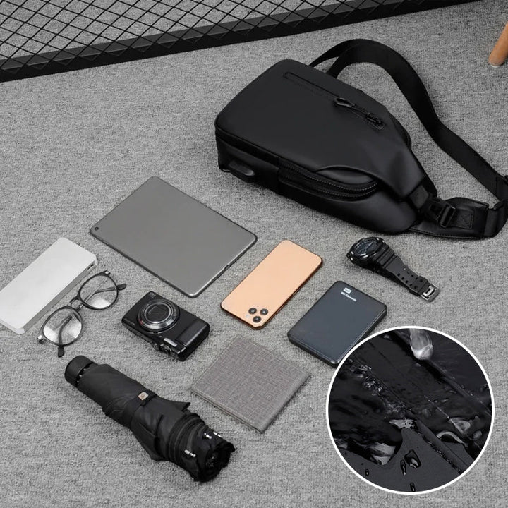 Organization within the unisex waterproof travel sling bag, displaying pockets for phone, keys, and wallet.