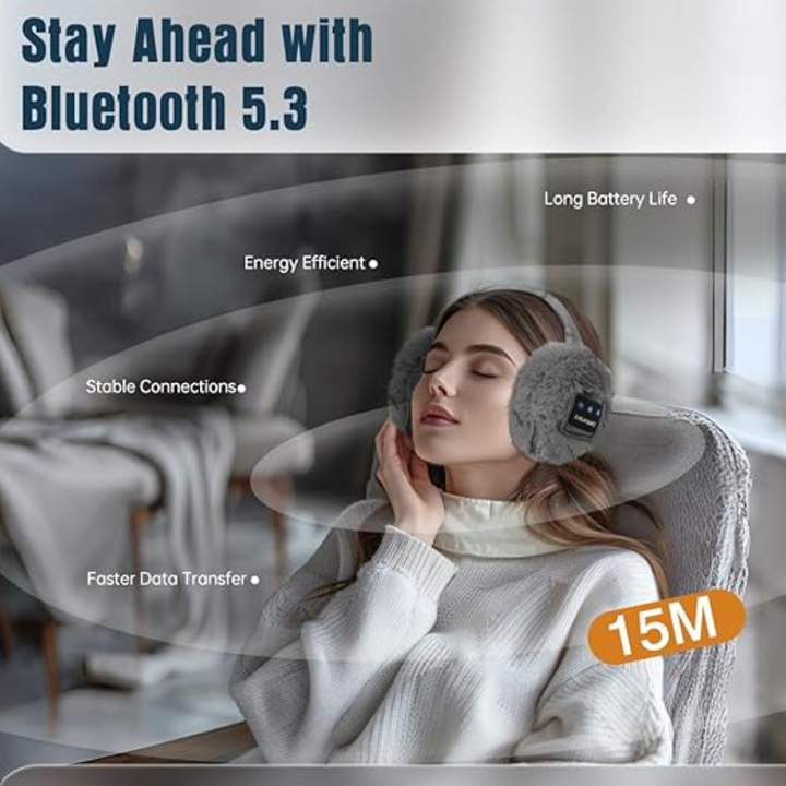 Person enjoying wireless music outdoors with CozyGrooves Bluetooth ear warmers in cold winter weather.