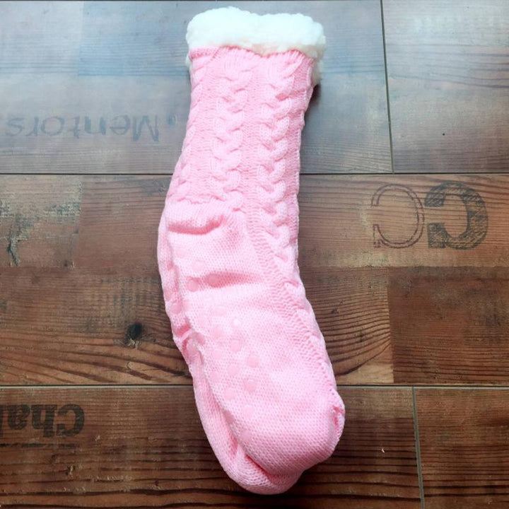 Black unisex home slipper socks, fleece-lined for warmth, anti-slip dots for safety.