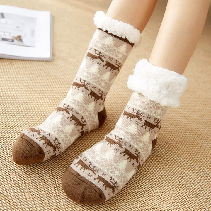 Warm unisex fleece-lined slipper socks by window, anti-slip sole, cozy winter indoor footwear.