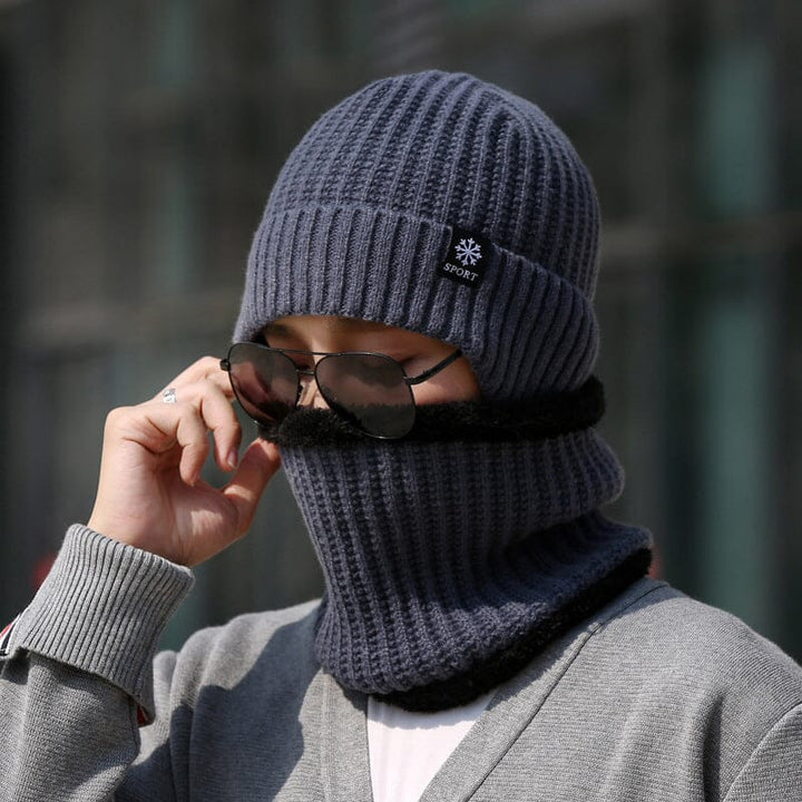 Model wearing a unisex winter knit beanie hat and scarf set, ideal for cold weather