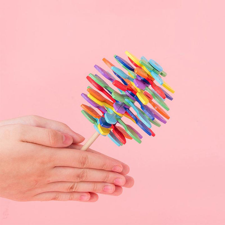 Close-up of a wooden Fibonacci lollipop fidget toy, showcasing its unique spiral design