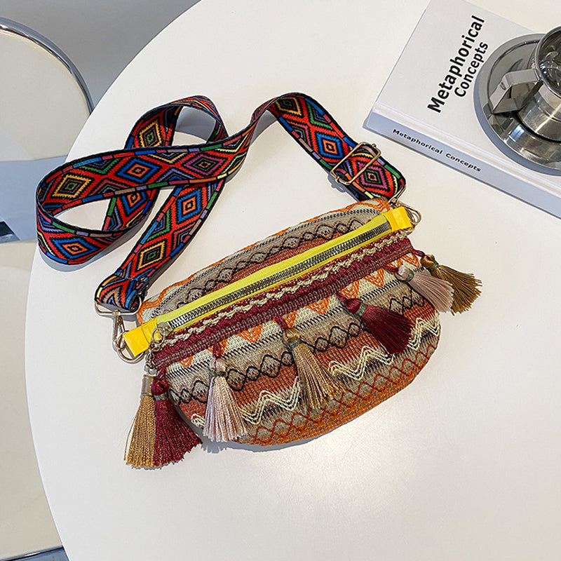 Detailed shot of the vibrant, multicolored woven fabric of a bohemian unisex waist bag.