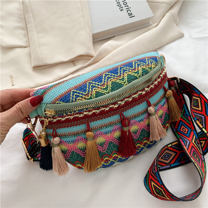 Boho canvas waist bag with intricate woven pattern, ideal for a festival outfit.