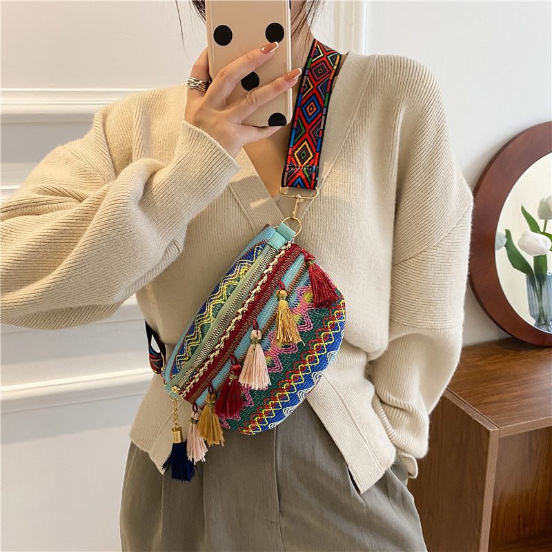 Unisex bohemian bag, versatile as a waist or shoulder bag, featuring colorful woven fabric.