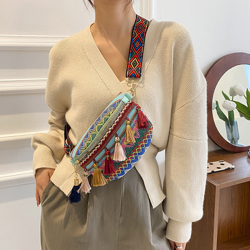 Close-up of a woven bohemian waist bag, showcasing its unique colorful texture.