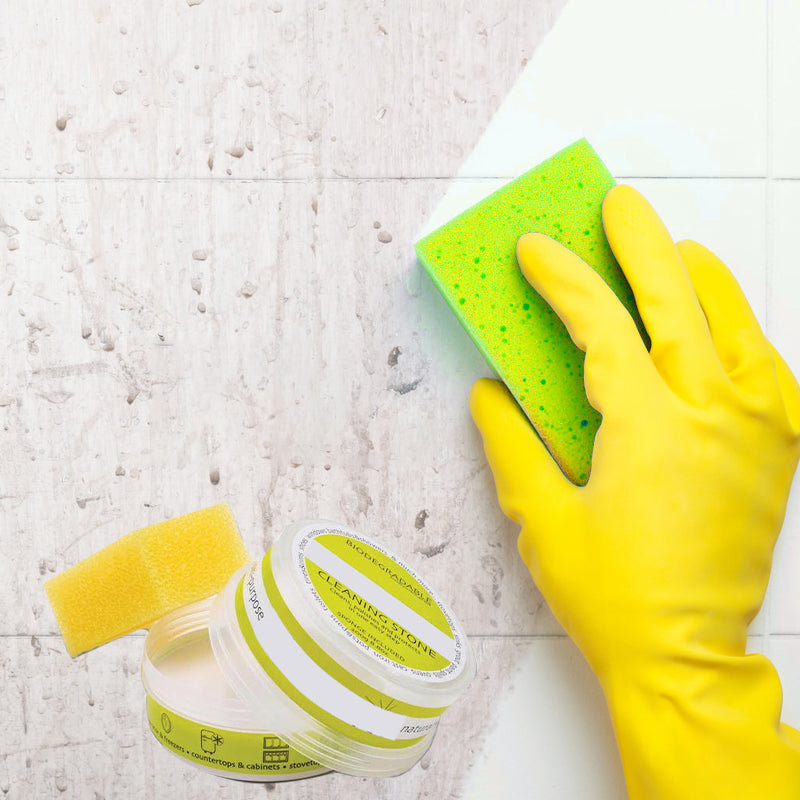 Universal All-Natural Cleaning Stone effectively cleaning a kitchen sink, natural stain remover