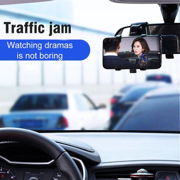 Black universal phone holder mounted on a car's dashboard, perfect for easy GPS viewing while driving